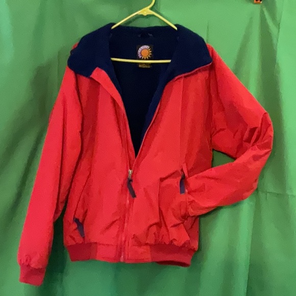 Bright red windbreaker with navy blue fleece lining and insulated sleeves. - Picture 10 of 11